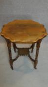 A Victorian walnut shaped top occasional table. H.76 W.76cm