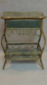 A late 19th century rattan and wicker shaped top dressing table with lift up lid revealing fitted