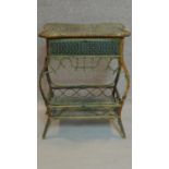 A late 19th century rattan and wicker shaped top dressing table with lift up lid revealing fitted