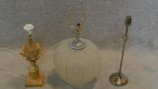 A bulbous glass table lamp, a carved gilt acanthus shaped table lamp and a single rosebud