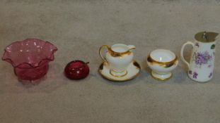 A Thomas Goode milk jug and bowl, another Victorian jug and two pieces of Cranberry glass.