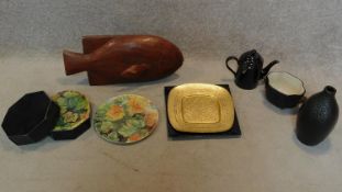 A boxed set of foliate design plates, a tureen with ram's head handles, a carved fish and other