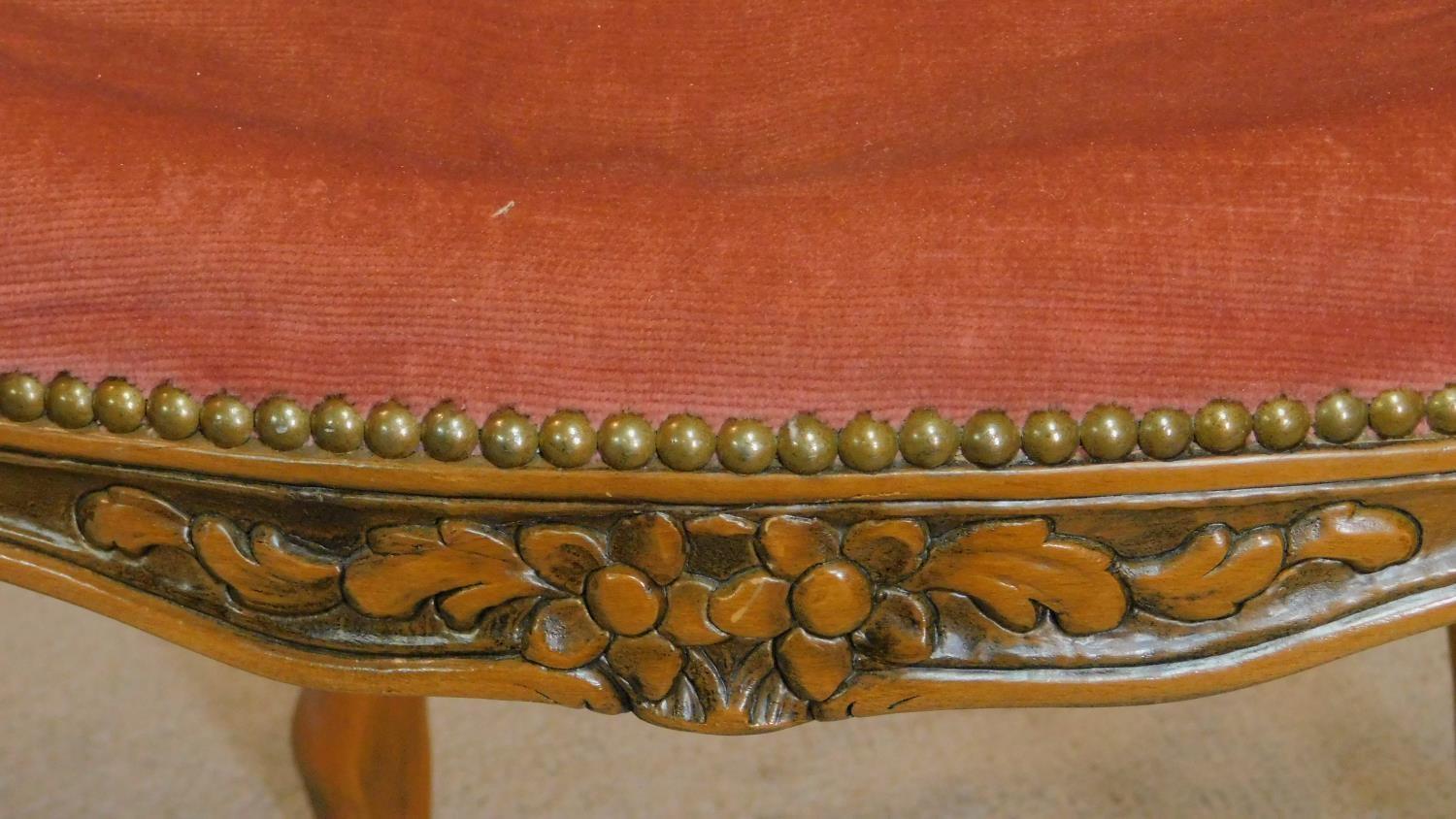 A pair of French carved beech framed open armchairs in blush upholstery on cabriole supports. H.96cm - Image 4 of 8