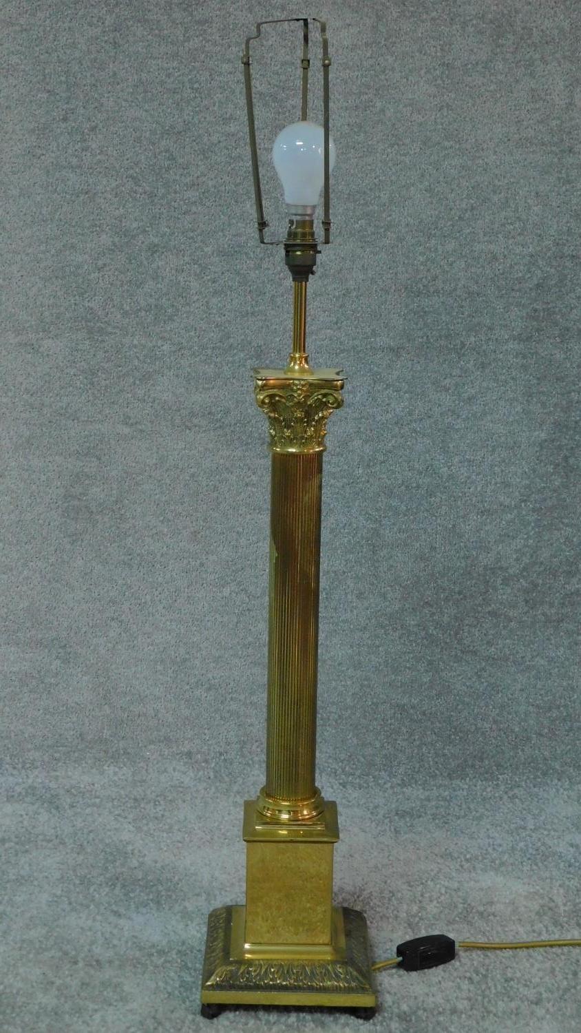 A large brass Corinthian column style table lamp. H.96cm