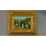 A 19th century oil on canvas laid on board of two spaniels in decorative gilt frame. 43x38cm