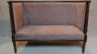 A late 19th century mahogany carved frame two seater canape in a blush fabric upholstery H.100 W.135