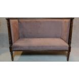 A late 19th century mahogany carved frame two seater canape in a blush fabric upholstery H.100 W.135