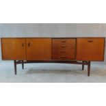 A mid 20th century teak G-Plan sideboard fitted cupboards and drawers. H.79 W.206 D.48cm