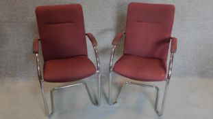 A pair of chrome framed boardroom chairs. H.94cm