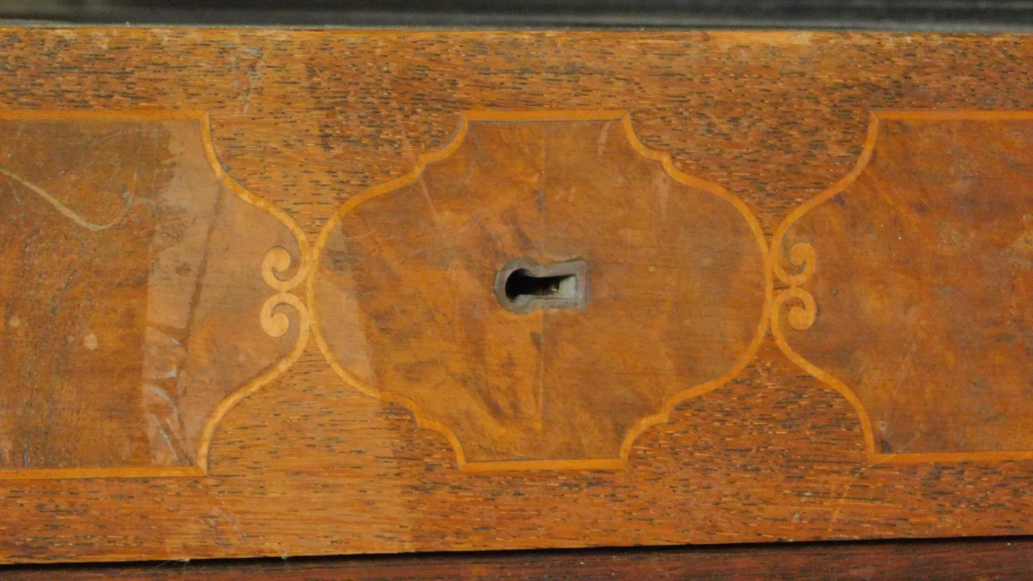 A continental oak and walnut kneehole desk fitted cupboards enclosing slides on reeded bun feet. H. - Image 6 of 7