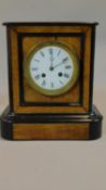 A 19th century walnut and ebonised mantel clock, enamel dial. H.27 W.24 D.14cm