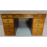 A Victorian oak partners desk with original tooled leather top above frieze drawers and pedestal