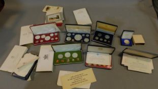 A large and miscellaneous collection of cased coins and commemorative stamps.