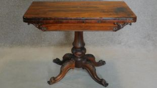 A Victorian rosewood card table on carved bulbous base on quadruped cabriole supports. H.74 W.92 D.