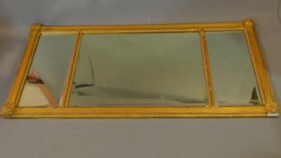 A 19th century gilt framed triple section overmantel mirror. 112x53cm