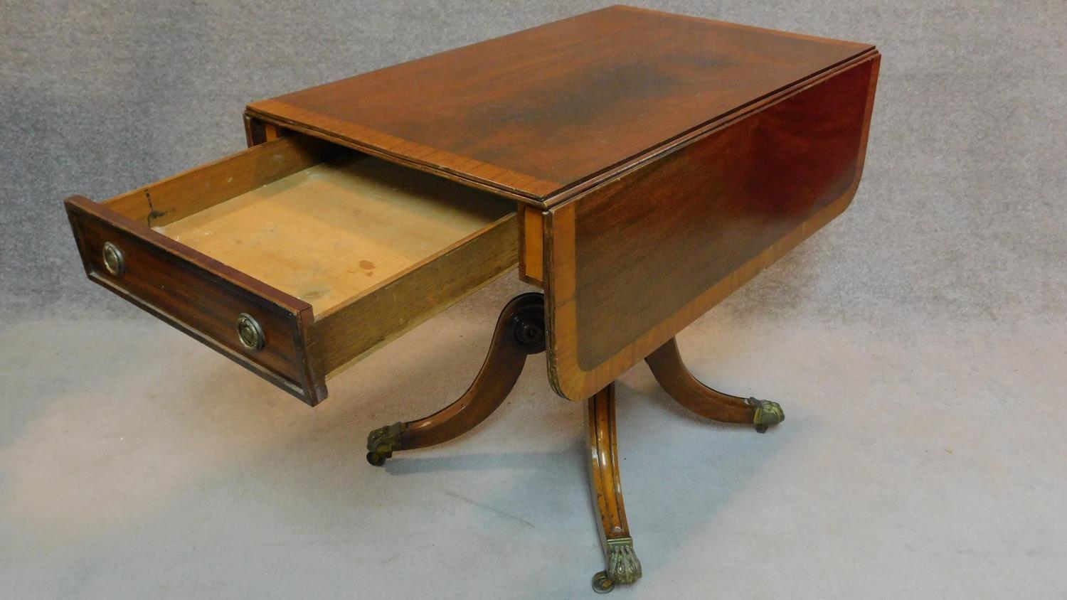 A Regency mahogany and satinwood crossbanded drop flap Pembroke table on carved quadruped cabriole - Image 2 of 8