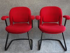 A pair of red upholstered Herman Miller armchairs on tubular metal cantilever bases. H.83
