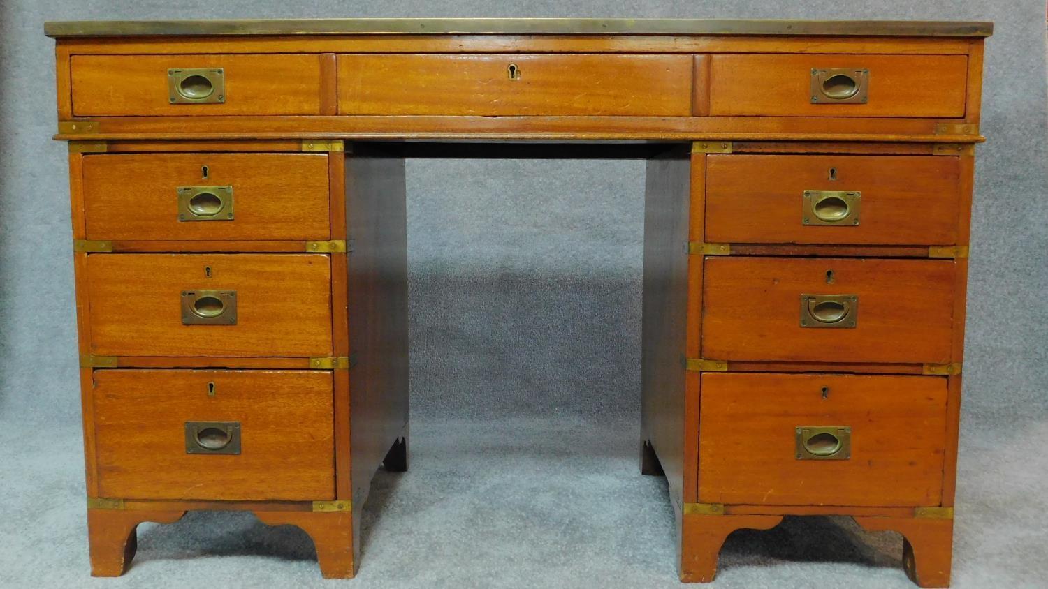 A 19th century mahogany three section brass bound military style campaign chest with inset tooled