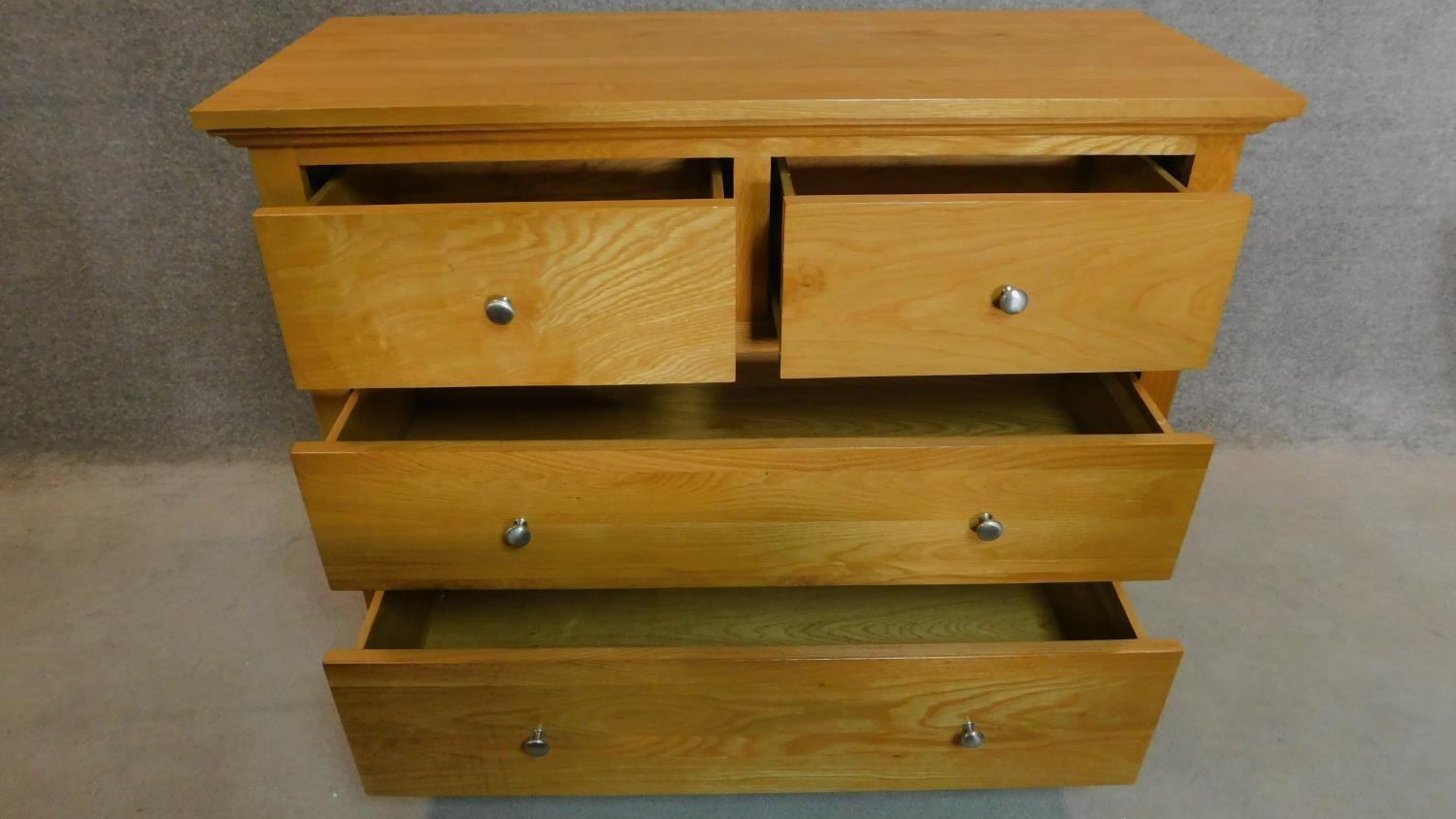 A contemporary oak chest of two short over two long drawers. H.93 W.116 D.48cm - Image 2 of 4