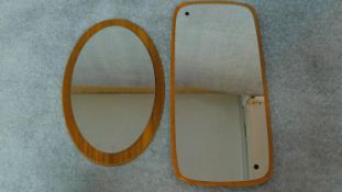 A mid 20th century teak framed mirror and another similar. 72x34cm