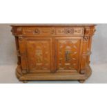 A 19th century Flemish style oak carved cabinet fitted doors and drawers. 100x155x44cm