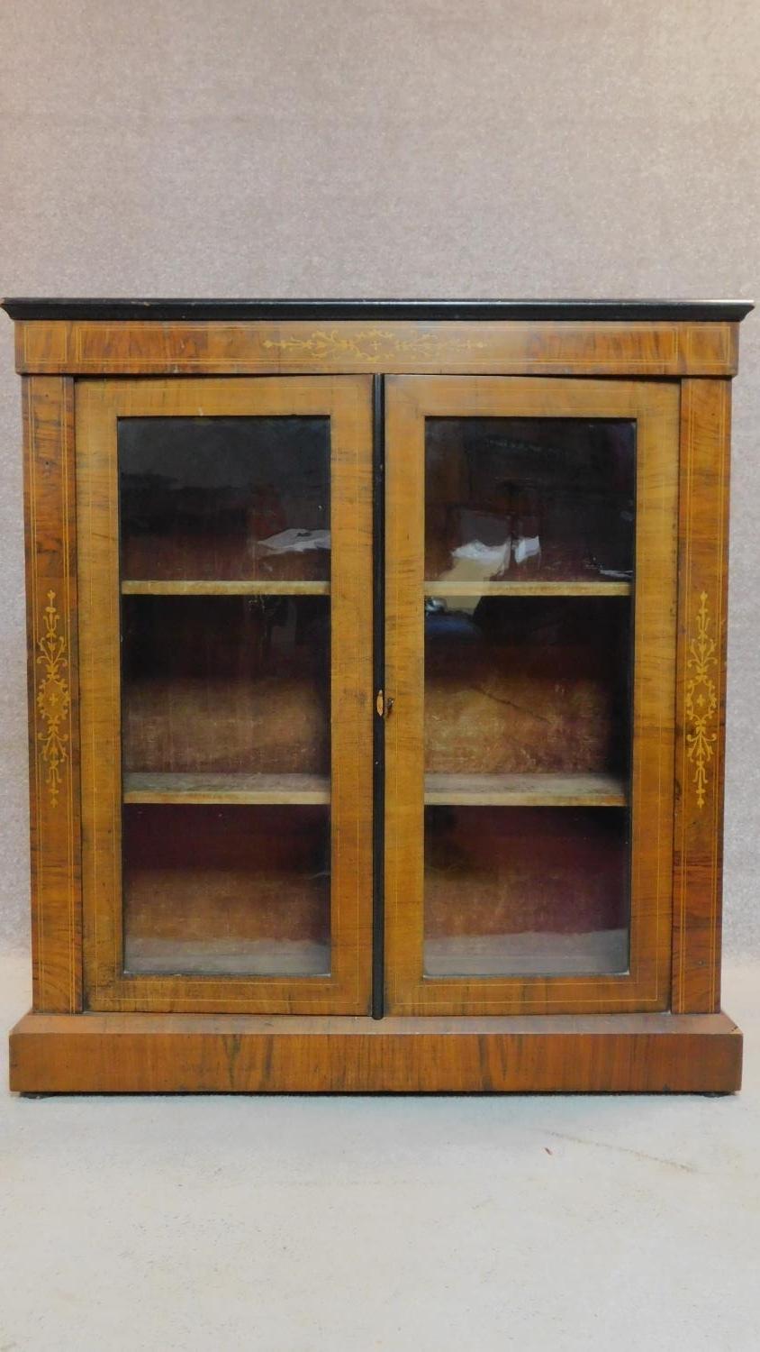 A Victorian two door walnut pier cabinet with satinwood Arabesque inlay. H.99 W.91 D.30cm