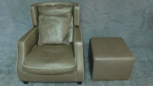 An Art Deco style leather upholstered armchair with cream piping with a matching footstool. H.