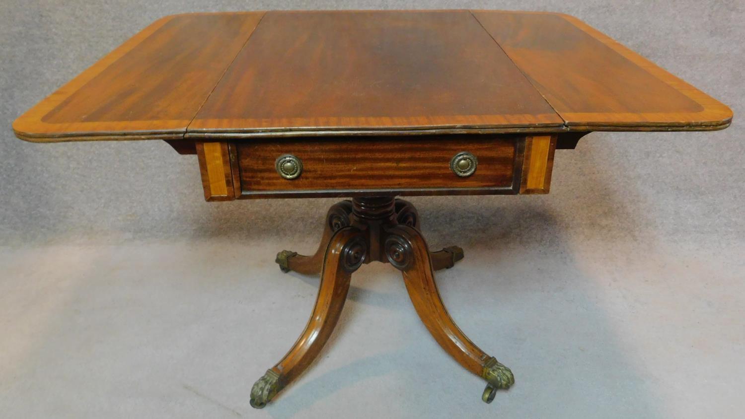 A Regency mahogany and satinwood crossbanded drop flap Pembroke table on carved quadruped cabriole - Image 3 of 8