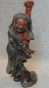 A carved Chinese polychrome standing figure. H.66