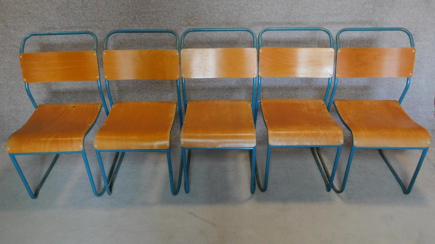 Five vintage 1950's plywood and metal stacking chairs. H.90cm