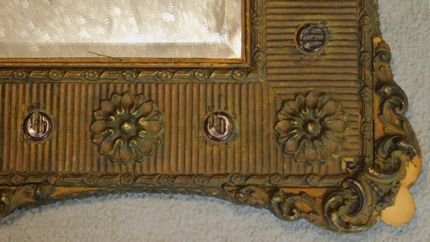 A 19th century gilt and gesso wall mirror with floral borders inset bevelled glass plate. 72x64cm - Image 2 of 4