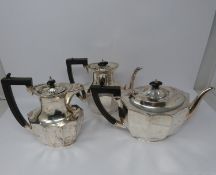 A 3 piece silver service; coffee pot, water jug and large tea pot, coffee pots William Devenport,