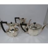 A 3 piece silver service; coffee pot, water jug and large tea pot, coffee pots William Devenport,