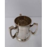 A three handled silver tyg/loving cup, Birmingham, 1919 by Martin Hall & Co Ltd. (119g).