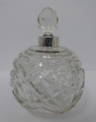 Three cut glass and silver perfume bottles and a cut glass atomiser with silver collar, Chester,