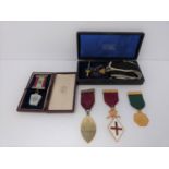 A group of Masonic medals, five including two silver, a double headed eagle holding sword with