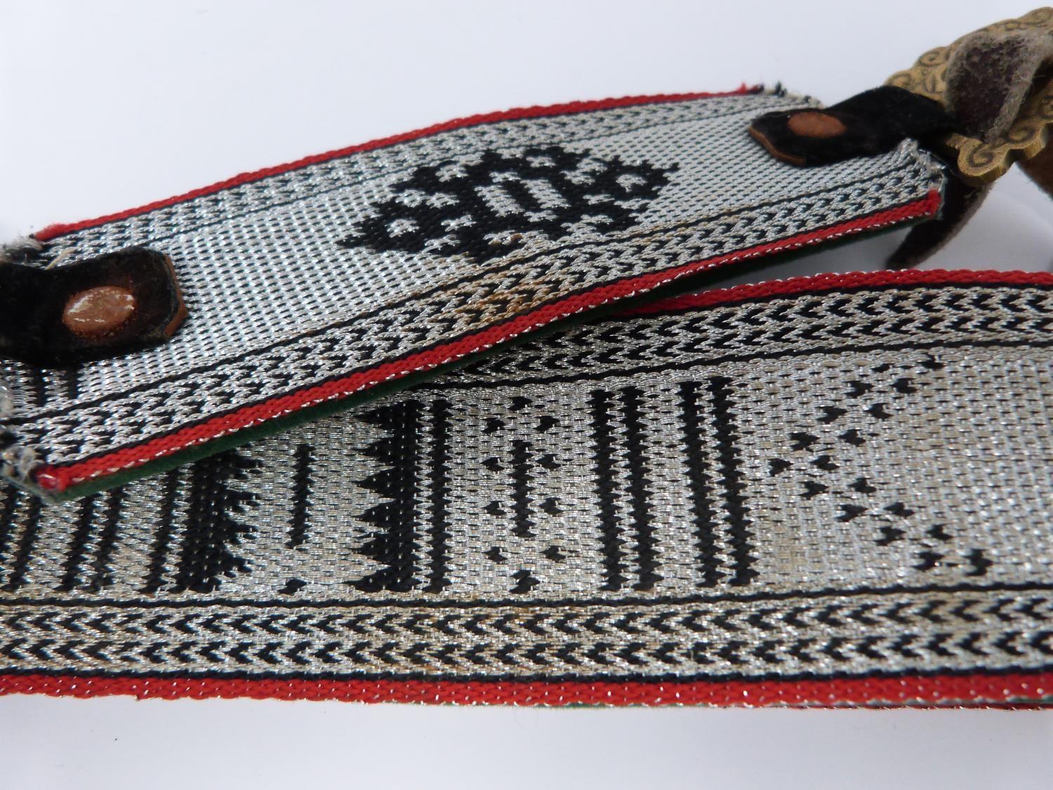 A 20th century silver Omani Khanjar with colourful and silver thread woven strap, covered with - Image 7 of 12