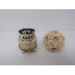 An early 20th century ivory puzzle ball and a small carved ivory and white metal burner, dragon