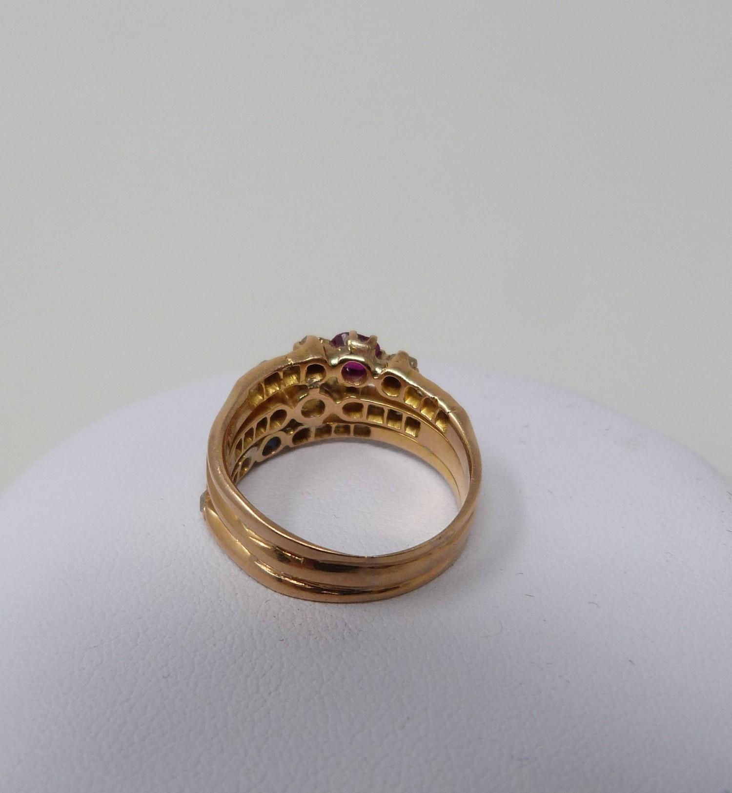 A Sapphire, Ruby and old mine diamond yellow metal jubilee ring, set to centre with a cushion shaped - Image 2 of 5