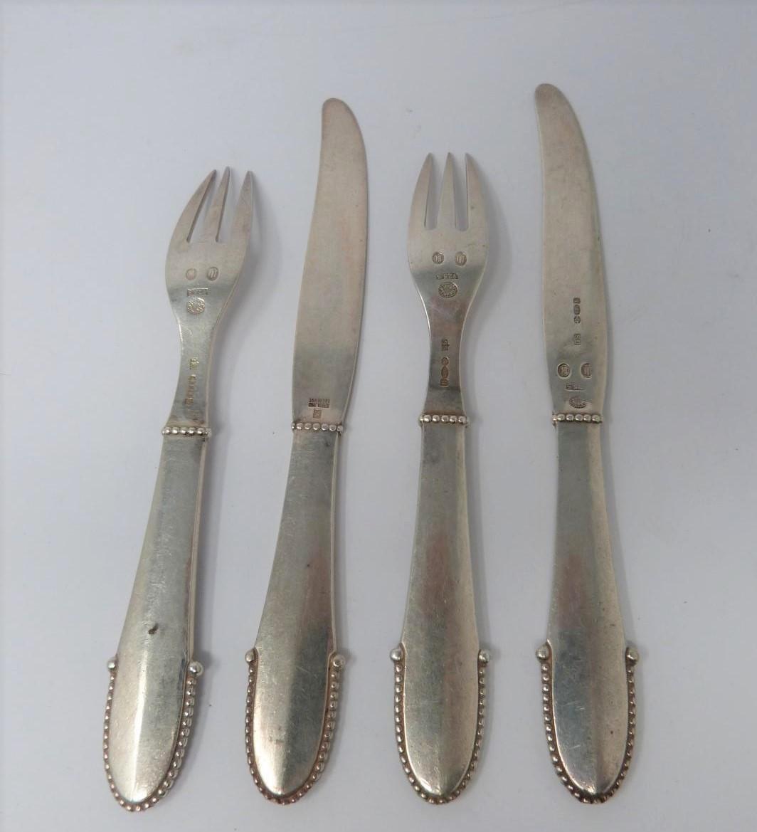 A Georg Jensen silver knife and fork set, full Danish hallmarked and makers mark for Georg - Image 2 of 5