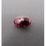 A Georgian/Victorian yellow metal oval garnet brooch inset with diamond, hollow foil backed cabochon