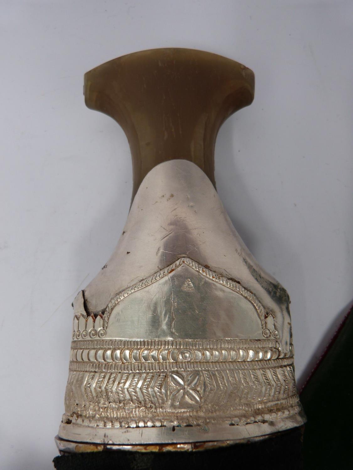 A 20th century silver Omani Khanjar with colourful and silver thread woven strap, covered with - Image 10 of 12