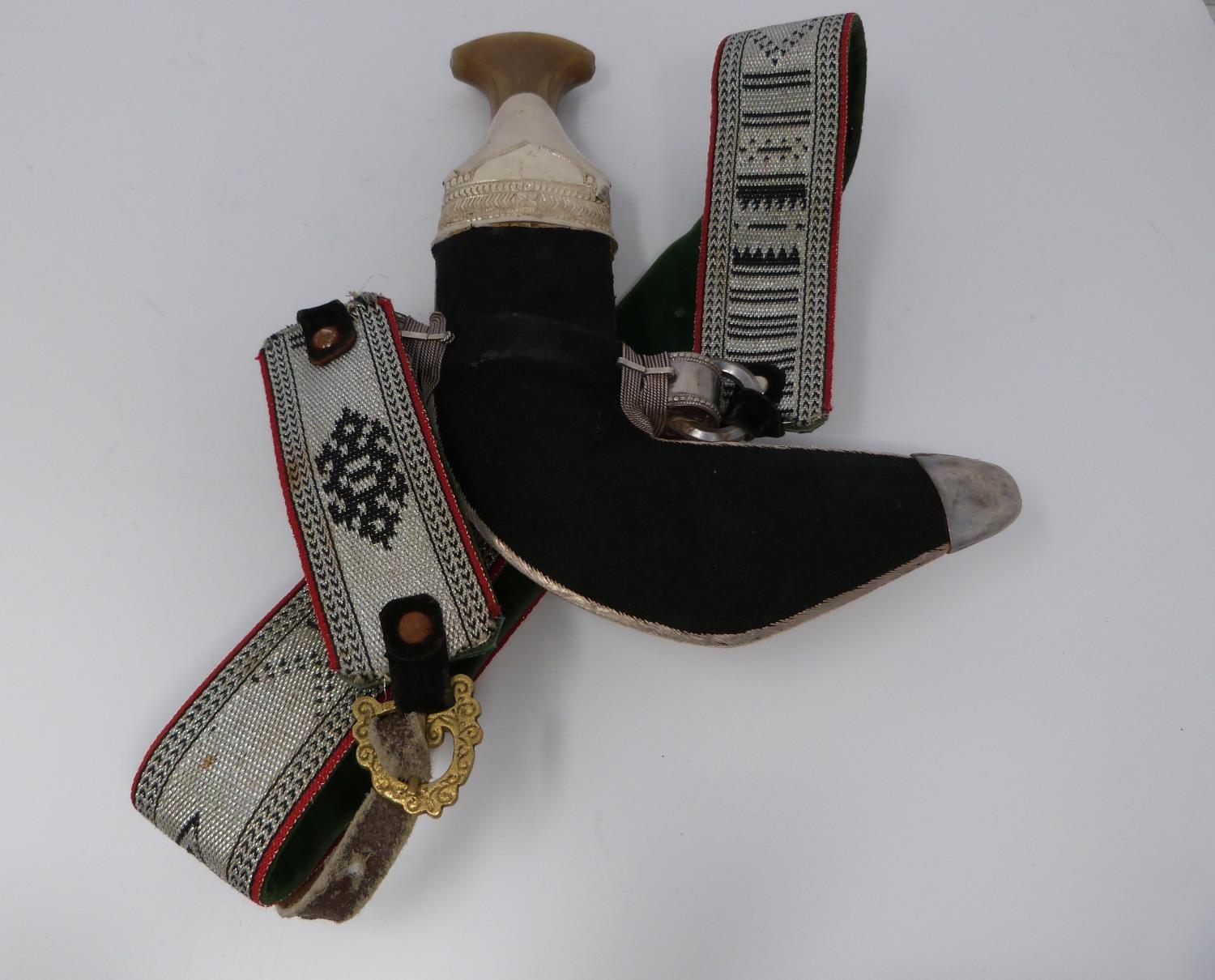 A 20th century silver Omani Khanjar with colourful and silver thread woven strap, covered with - Image 4 of 12