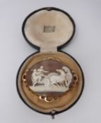 A 9ct stamped yellow gold landscape cameo brooch depicting man and woman climbing into a chariot