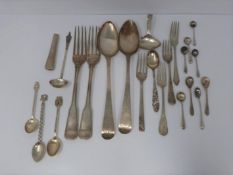 A collection of silver and white metal cutlery, including two Georgian serving spoons, 1791, ch