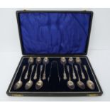 12 cased silver spoons and matching tongs, William Devenport, Birmingham, 1921, feather and leaf