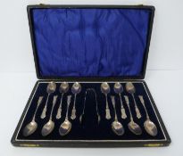 12 cased silver spoons and matching tongs, William Devenport, Birmingham, 1921, feather and leaf