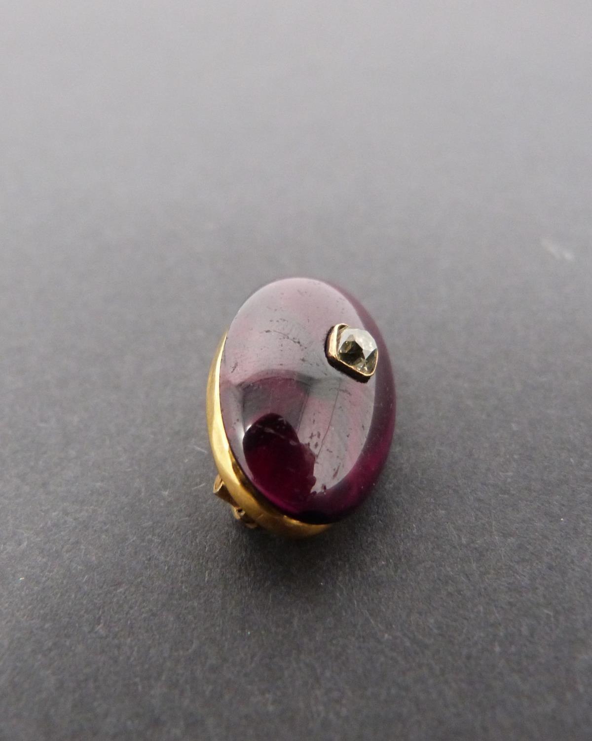 A Georgian/Victorian yellow metal oval garnet brooch inset with diamond, hollow foil backed cabochon - Image 4 of 6