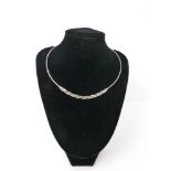 An 18ct white gold and diamond set collar necklace, double branched design, one polished one matt,