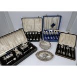 Two cased sets of coffee spoons, two silver dishes and two cased silver plated sets, EPNS grapefruit